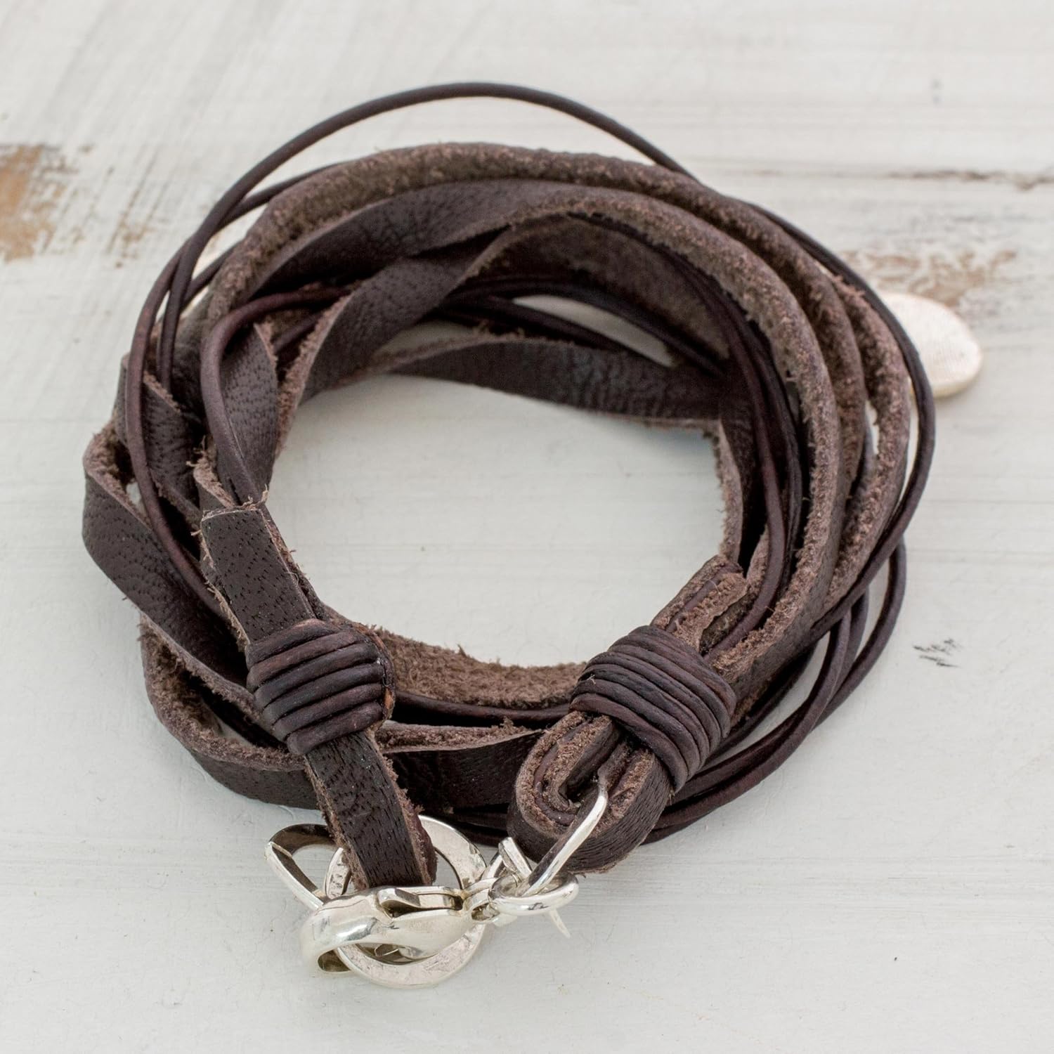 NOVICA Handmade Boho Leather Wrap Charm Bracelet - Stylish and Versatile Silver Charm Bracelets for Women and Men - Trendy Fashion Accessory, Stellar Imprint'